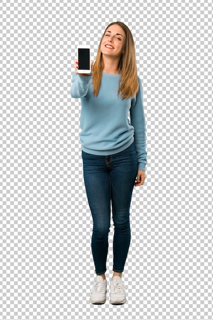 Blonde woman with blue shirt showing the mobile