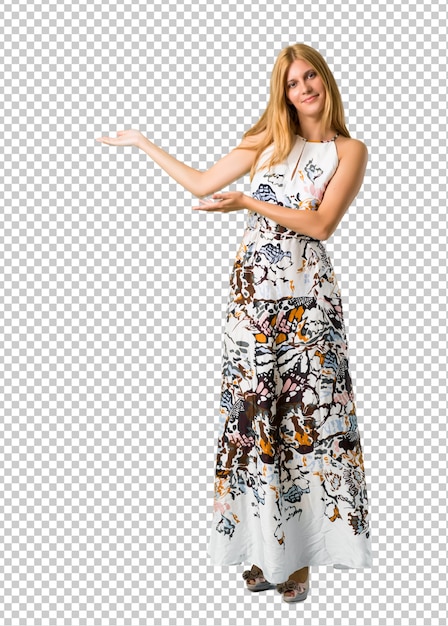 Blonde young girl in a summer dress presenting and inviting to come