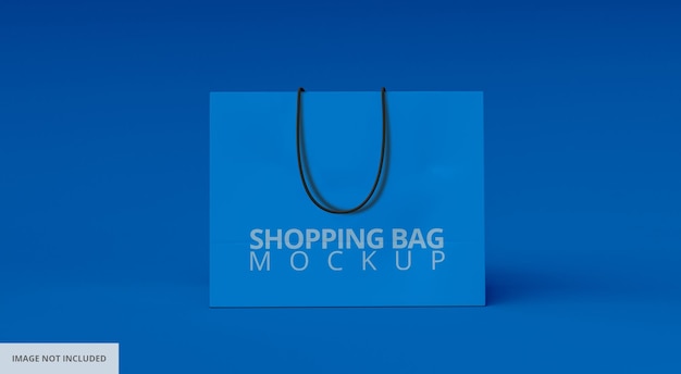 Mockup di shopping bag di carta blu vista frontale su sfondo blu