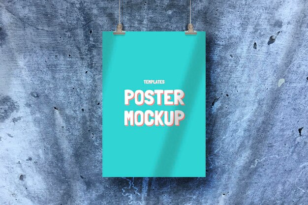 PSD blue hanging poster mockup on wall texture background