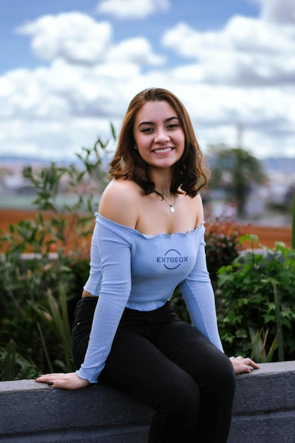 PSD blue logo mockup on a sky blue tank top