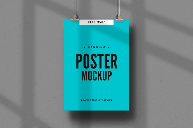 PSD blue poster mockup hanging on wall with shadow