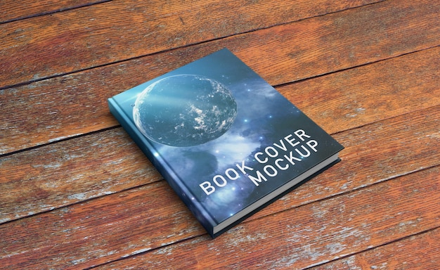 PSD book cover mockup on wooden surface