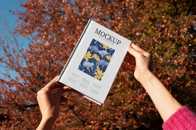 PSD book mockup in nature