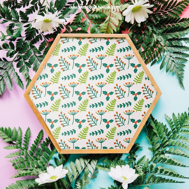 PSD botanical mockup with hexagonal frame and leaves