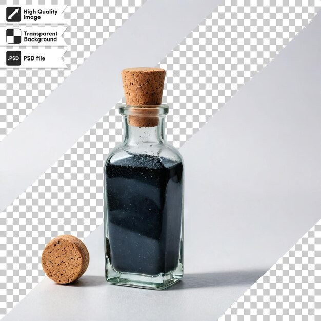 A bottle of black liquid sits next to a round cookie
