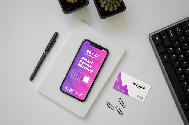PSD bovenaanzicht via telefoon en visitekaartje mockup