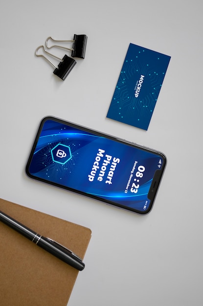 PSD bovenaanzicht via telefoon en visitekaartje mockup
