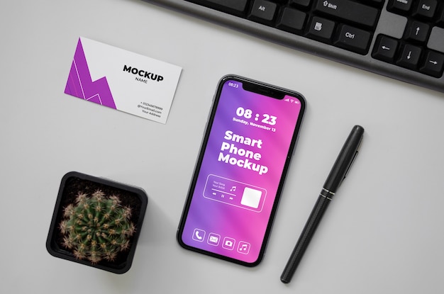PSD bovenaanzicht via telefoon en visitekaartje mockup