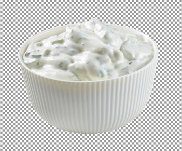 a bowl of sour cream with a green vegetable in it.