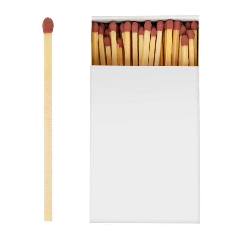 PSD box of wooden matches and match with red head on empty background