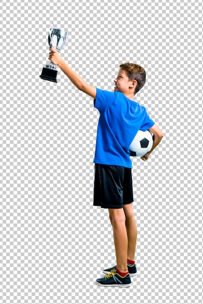 PSD boy playing soccer and holding a trophy