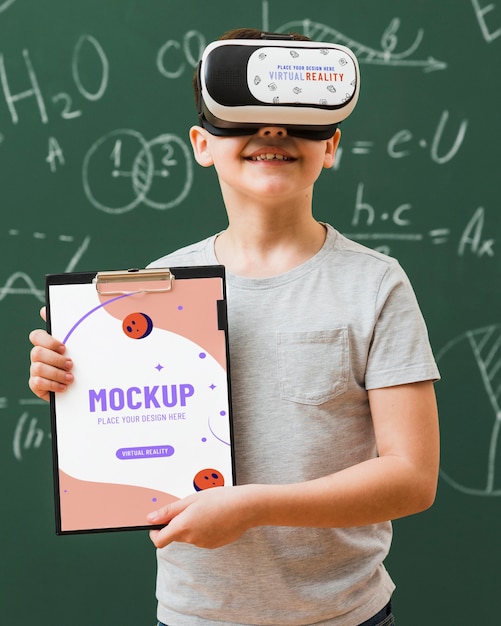 Boy wearing virtual reality headset with clipboard mock-up