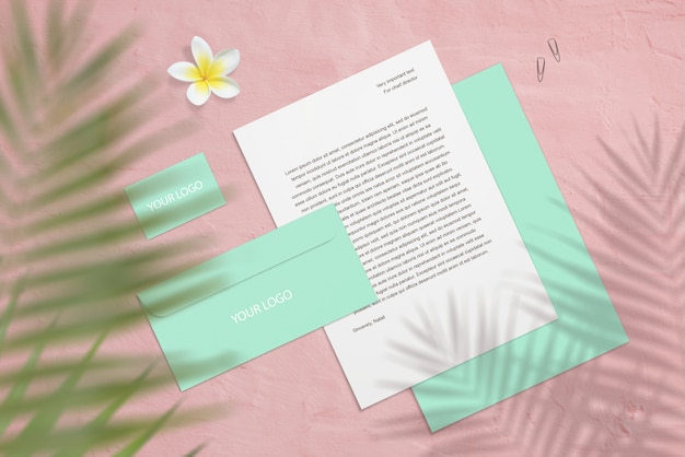PSD branding mockup with business cards, letter with flower and palm shadows