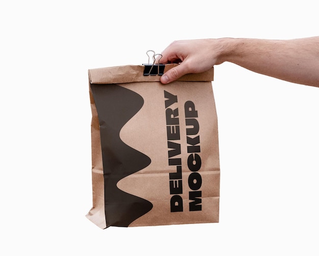 A brown paper bag with the words delivery on it