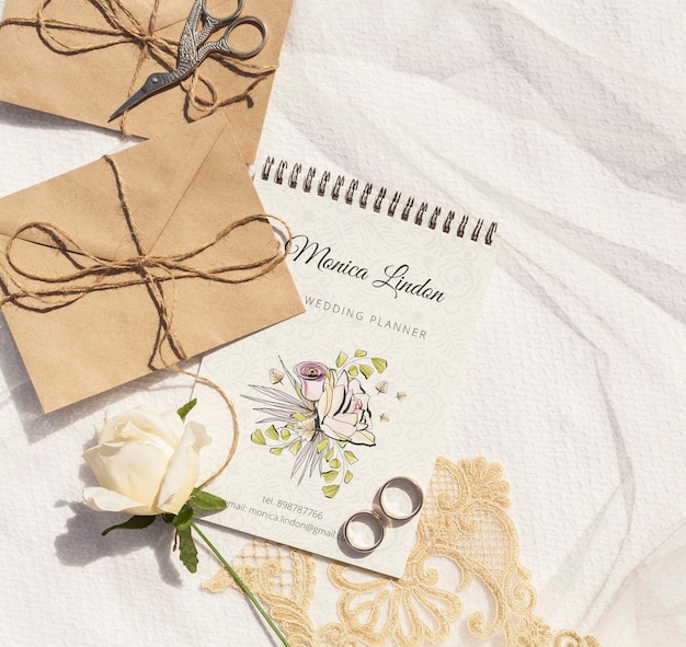 PSD brown paper envelopes with wedding rings and rose