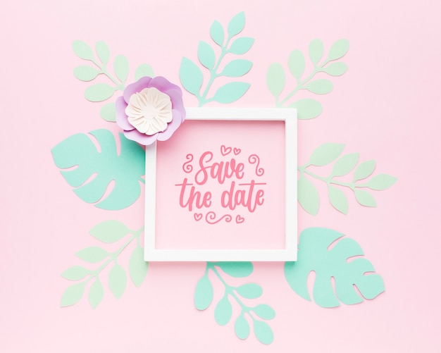 PSD bruiloft frame mock-up met papieren bladeren op roze achtergrond