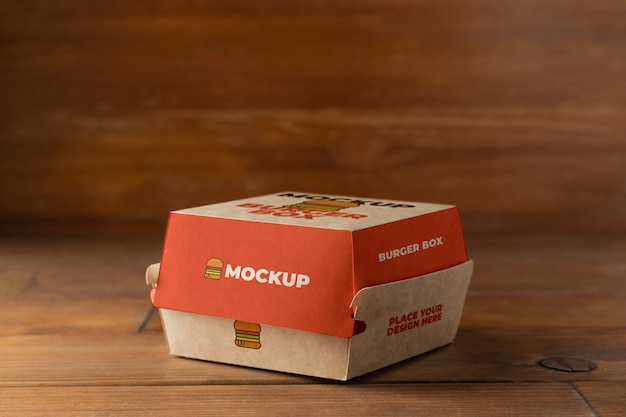 Burger box on wooden background