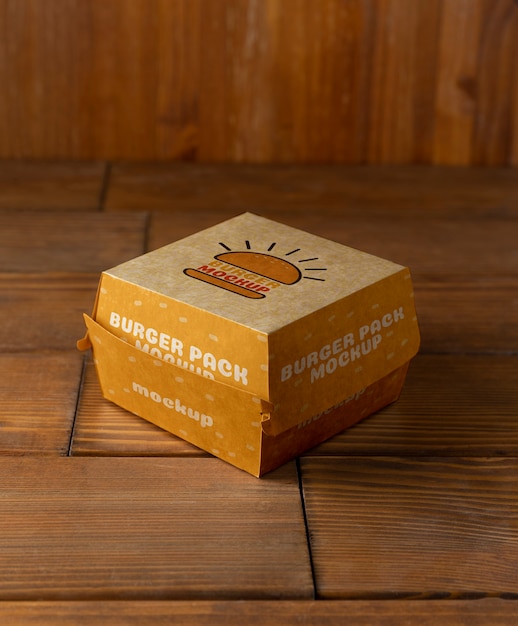 PSD burger packaging on wooden background