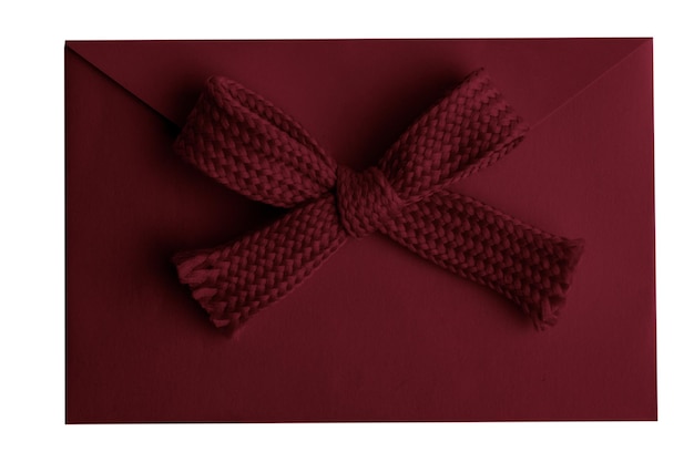 PSD burgundy envelope with a bow on a blank background