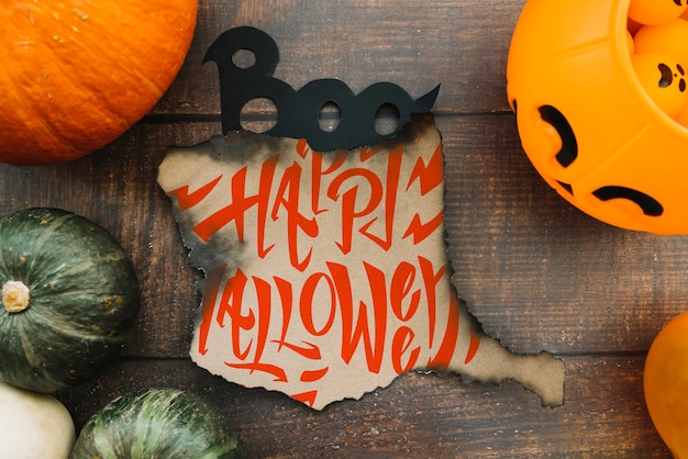 Burned paper mockup with halloween concept and pumpkins