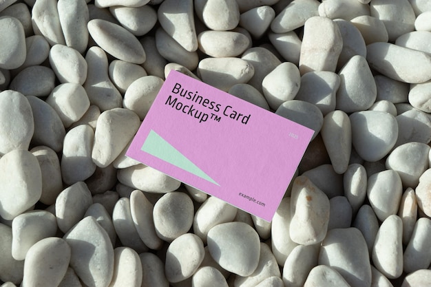 Business Card Laying on Pebbles Mockup