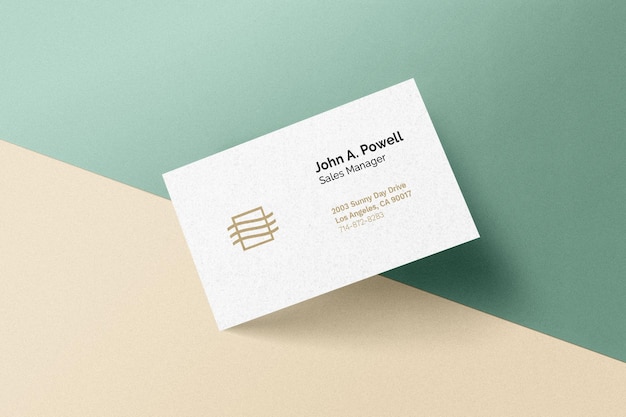 Business card laying on a wall mockup