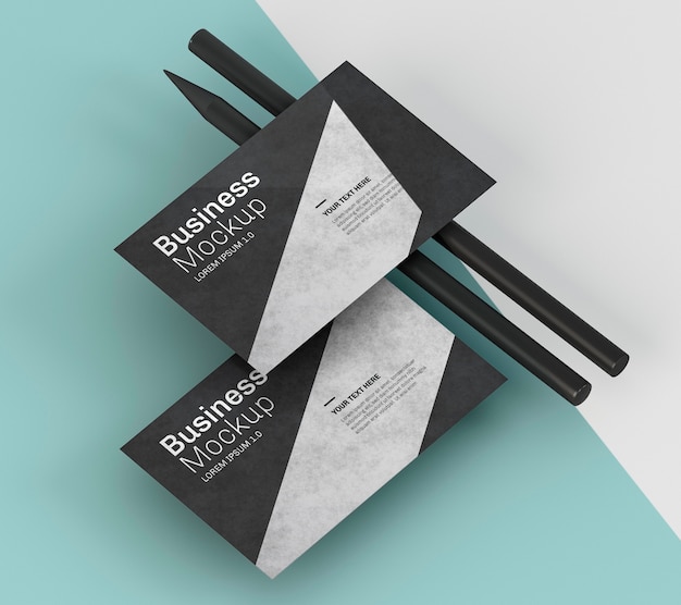 PSD business card mock-up and black pencils