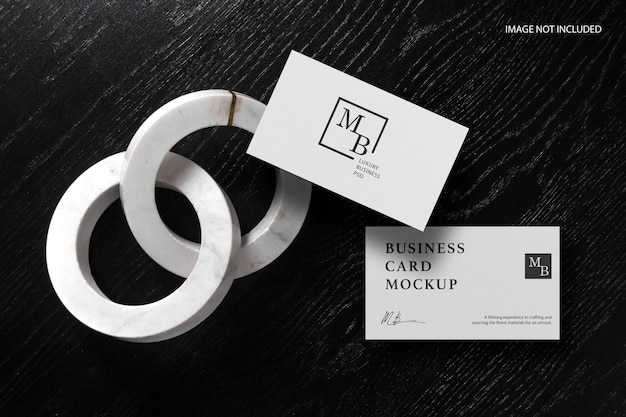 Business card mockup on black wood