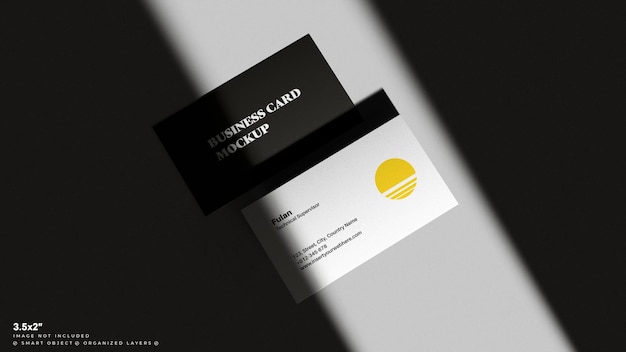 PSD business card mockup for branding showcase in a dark shadowy scene