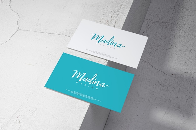 PSD business card mockup on wall background