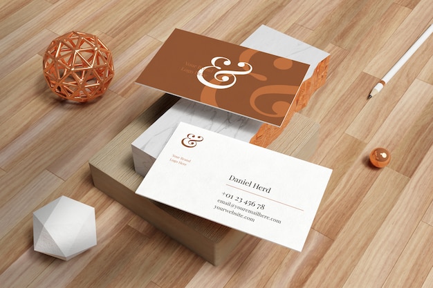 PSD business card mockup in white marble and wooden floor