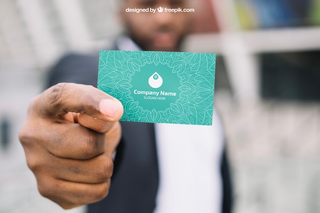 PSD business card mockup with blurred businessman