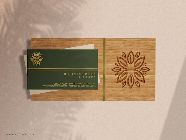 Business card mockup with embossed foil letterpress effect and debossed effect on wood