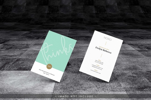 PSD business card mockup with grunge dark floor