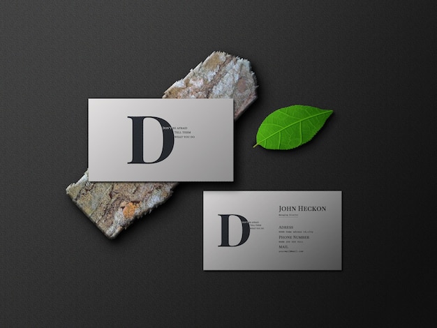 Business card mockup with leaves and log