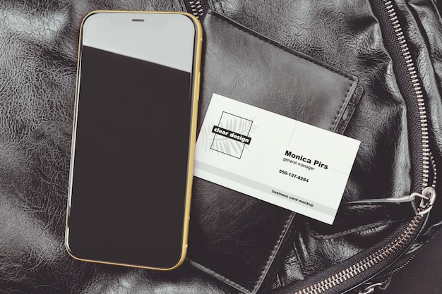 Business card on portmone with a phone scene mockup