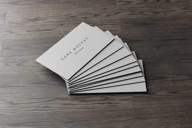 business card stack on wooden background mockup