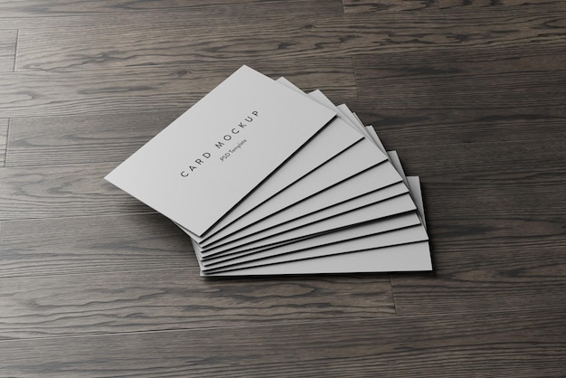 PSD business card stack on wooden background mockup