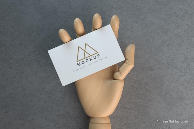 Business card in wooden hand mockup