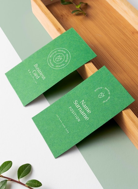 Business cards with wooden piece high angle