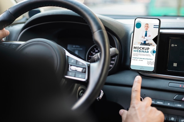 PSD business man in car with phone mockup