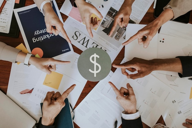 business people pointing at a dollar sign