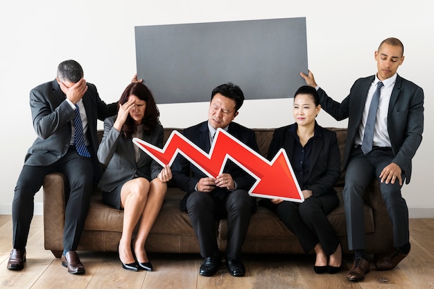 Business people sitting together with statistics icon