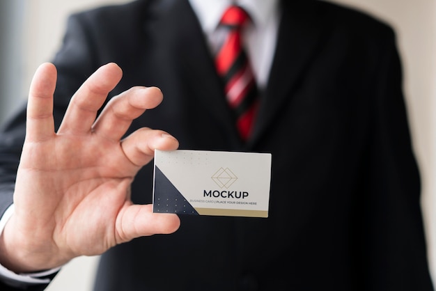 Businessman holding business card mock-up