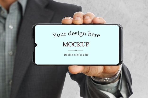 PSD businessman holds smartphone and shows mockup change design isolated background