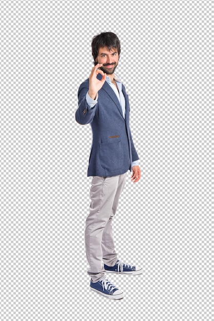 Businessman making ok sign over white background