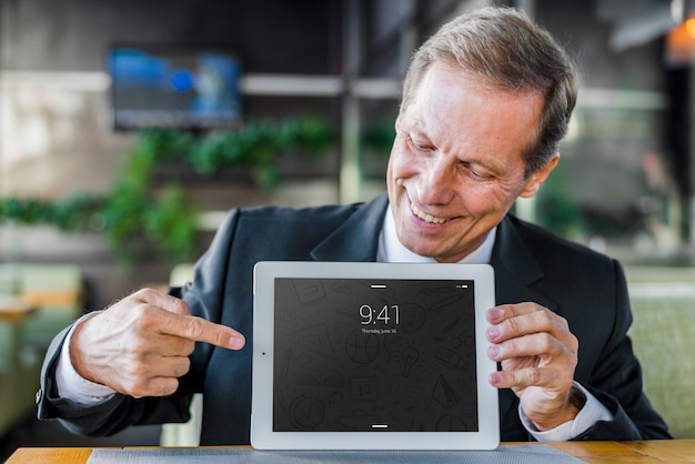 Businessman presenting tablet mockup