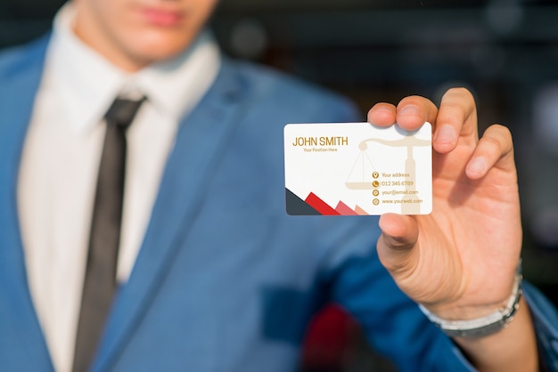 Businessman showing business card mockup