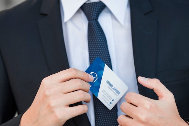 Businessman with business card mockup